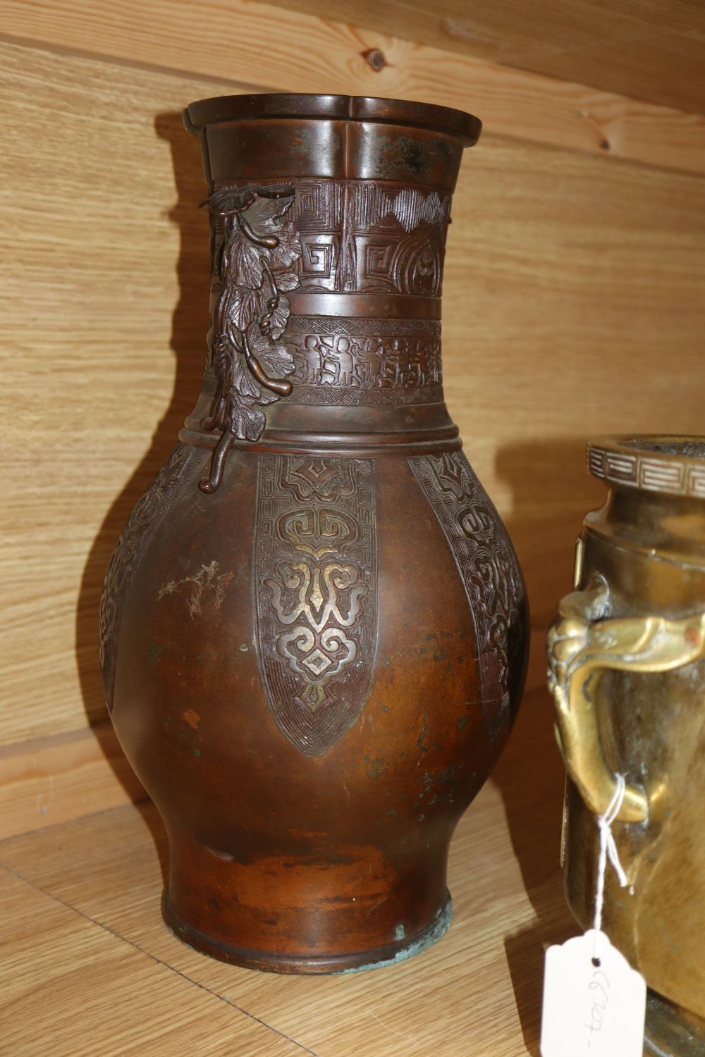 Two Chinese bronze vases and a jardiniere, tallest vase 37cm